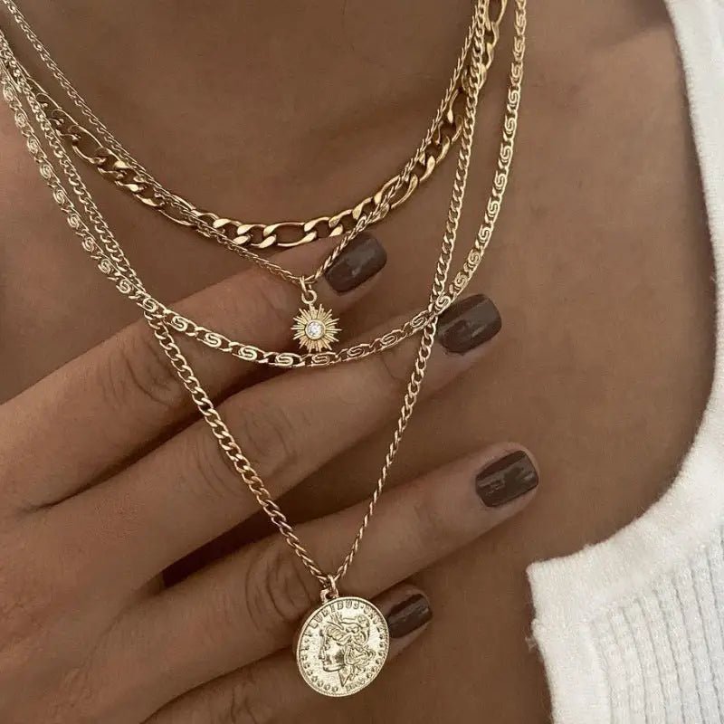 Chunky Gold Pendant Necklace with Layered Coin Design snake - label